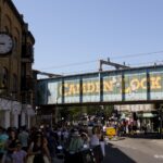 Camden Lock sign painted on the railway bridge above Camden Market