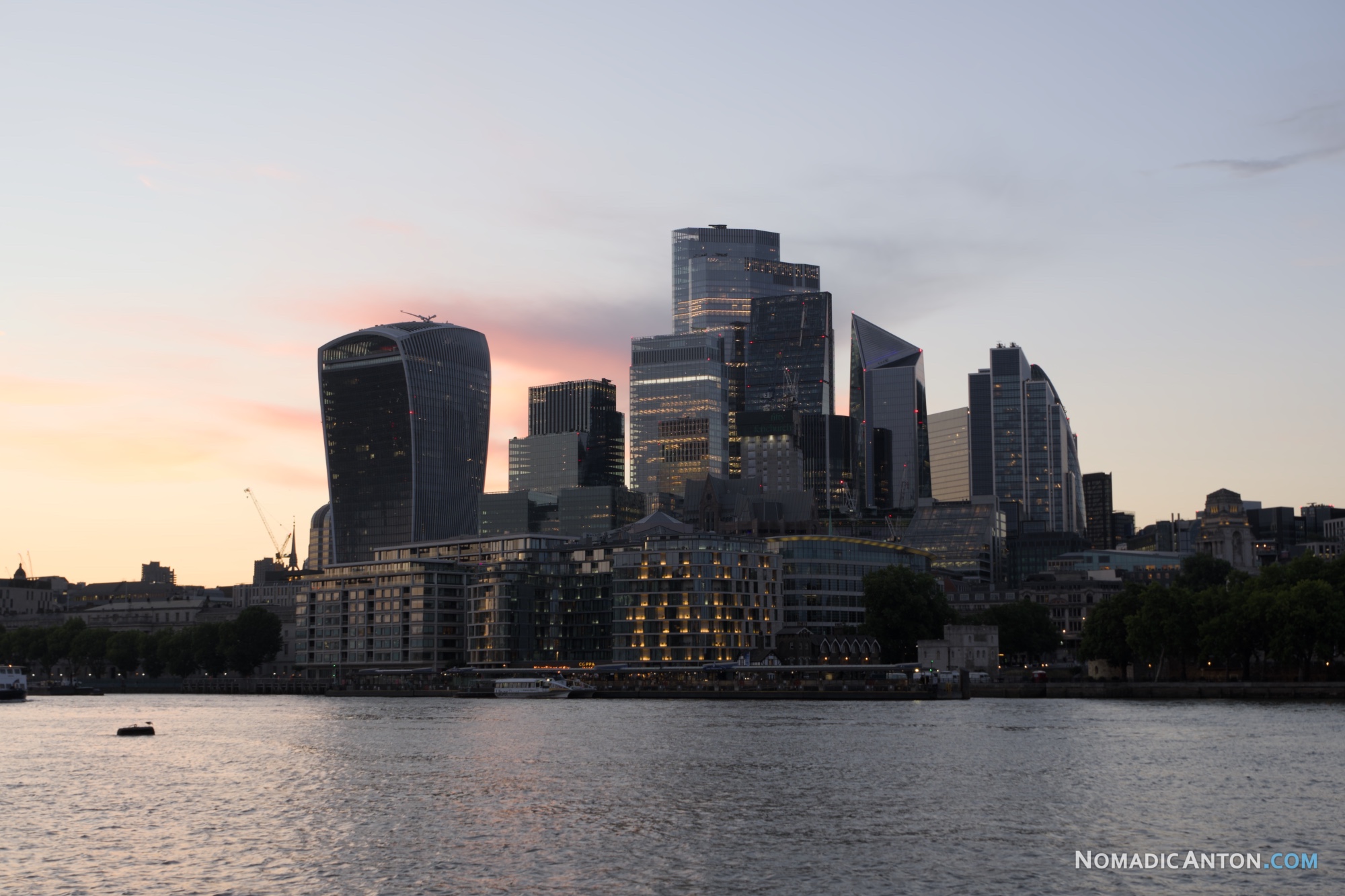 City of London financial district skyline at sunset, viewed from the River Thames