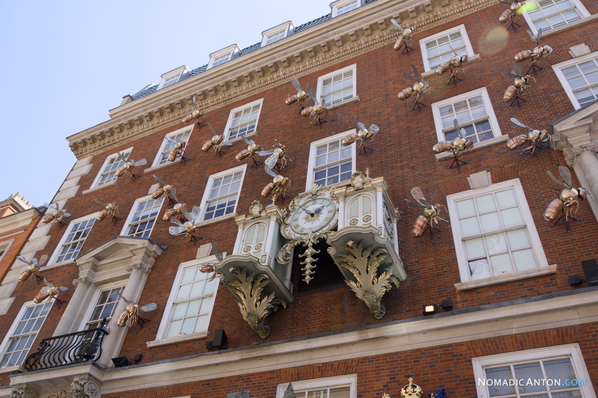 Fortnum & Mason's ornate clock and gold bee sculptures on its Piccadilly facade