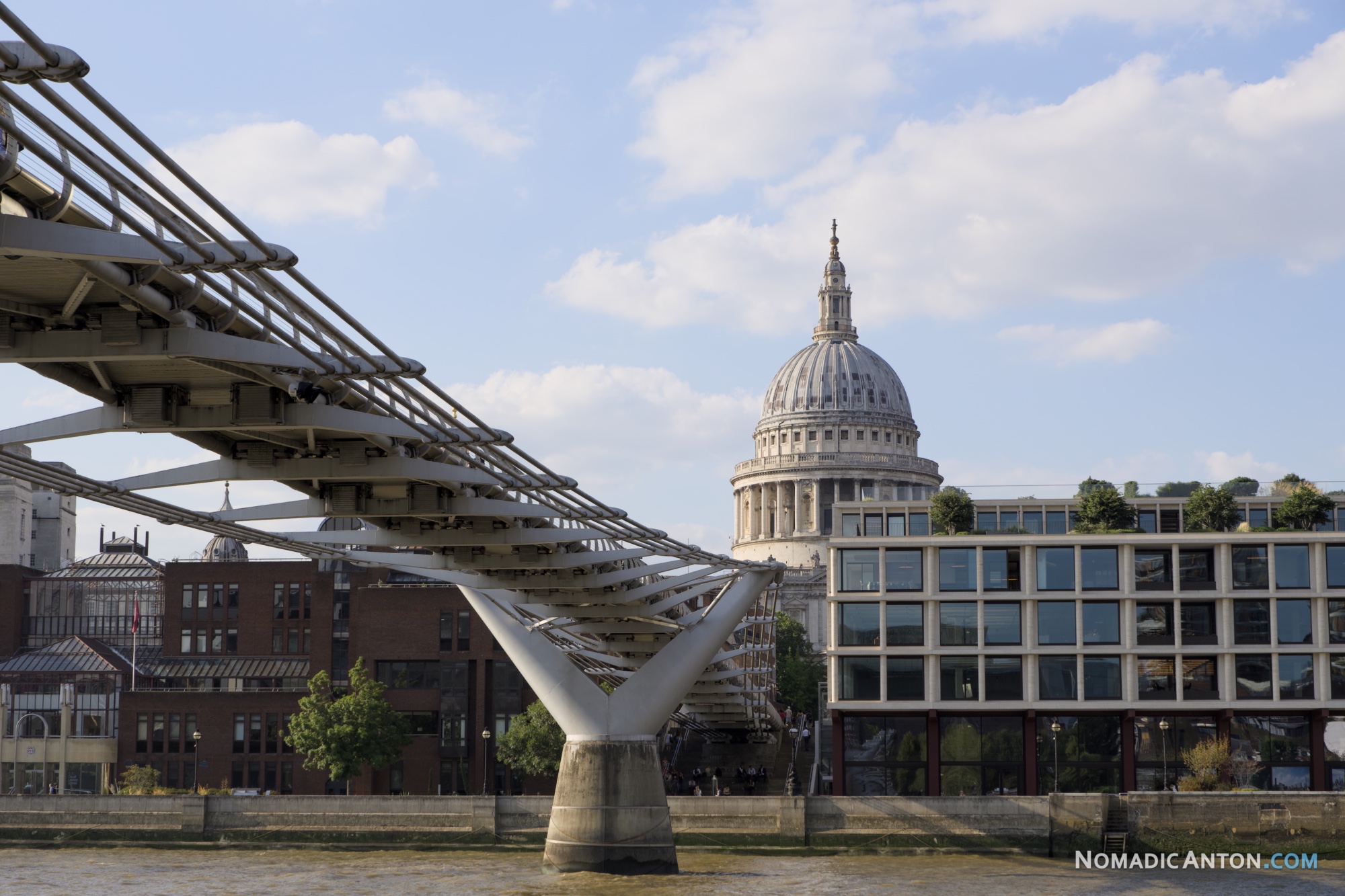 The Millennium Bridge with the dome of St Paul's Cathedral rising behind it