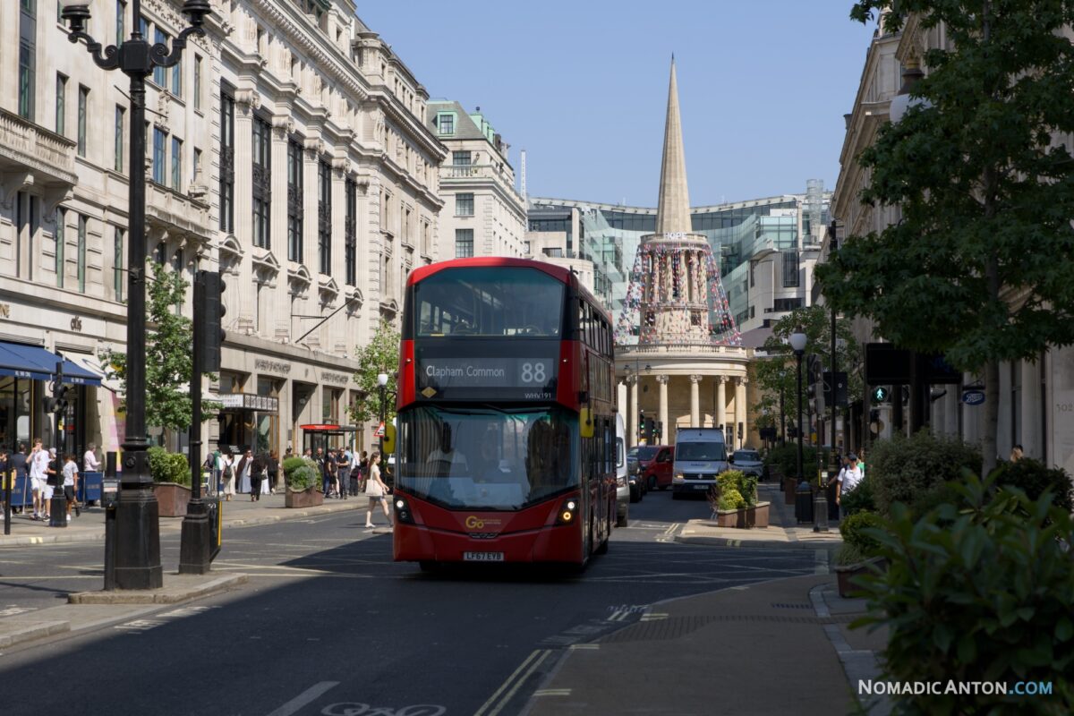 Double-decker bus on Regent Street with a domed church spire in the background