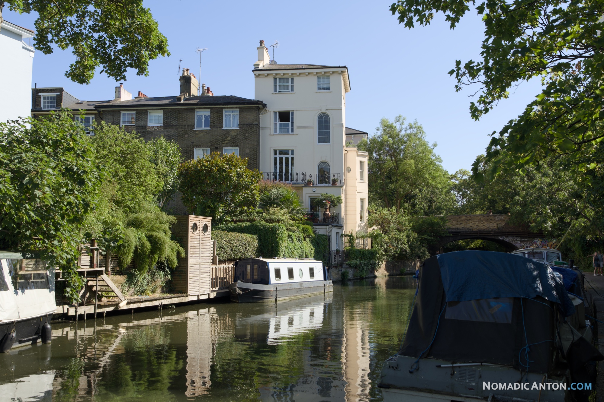 Narrowboats moored along Regent's Canal beside residential houses