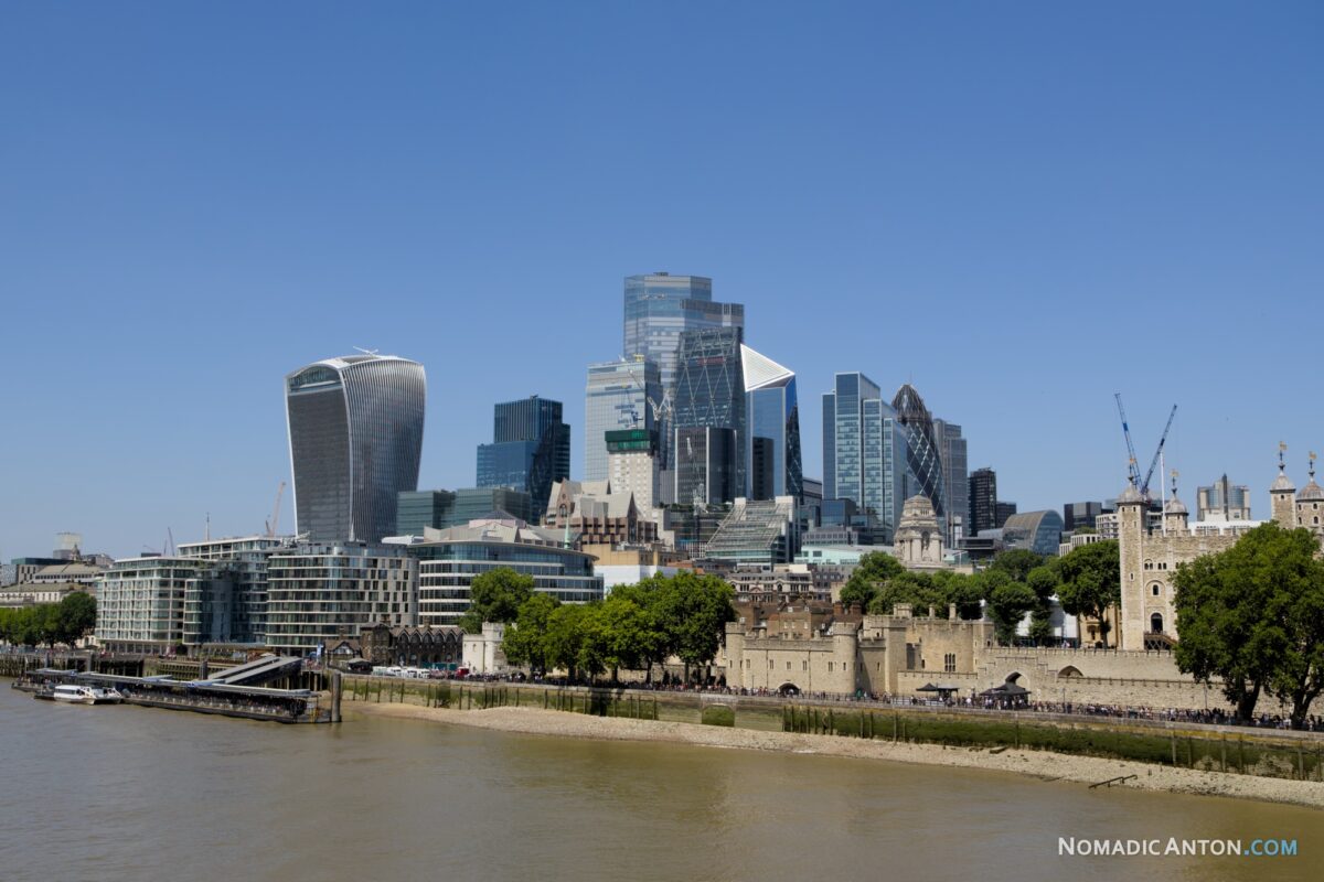 Skyscrapers of the City of London rising behind the Tower of London and the River Thames
