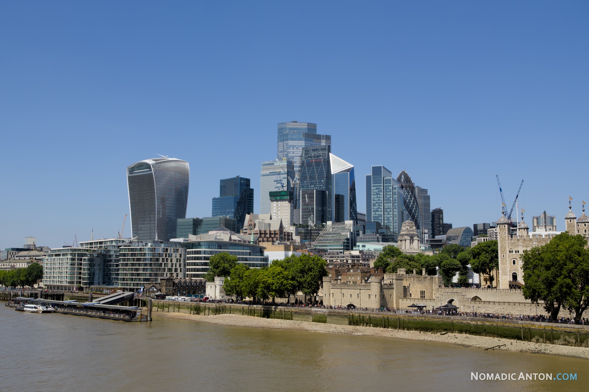 Skyscrapers of the City of London rising behind the Tower of London and the River Thames